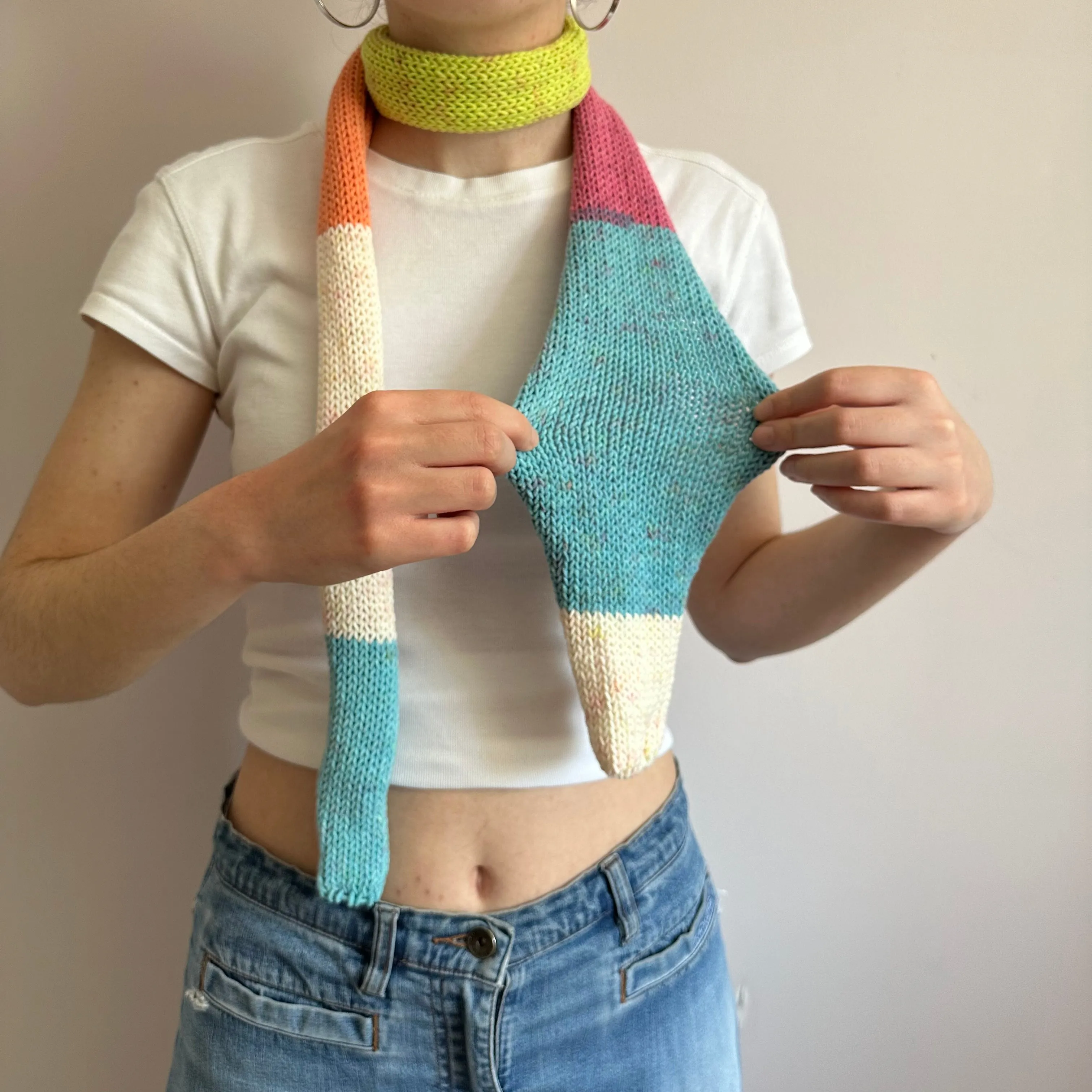 Handmade knitted colour block skinny scarf in blue, cream, orange, pink and green