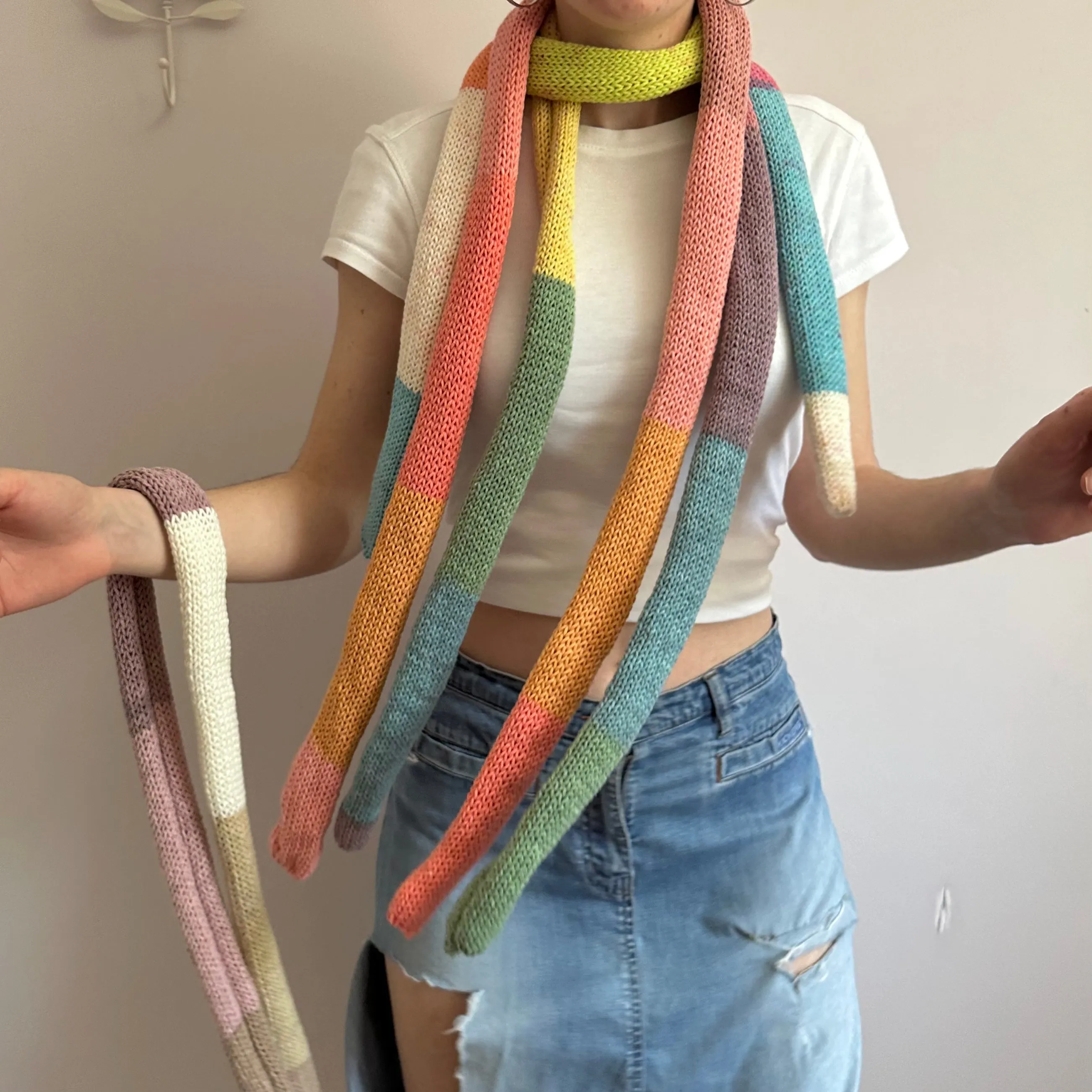 Handmade knitted colour block skinny scarf in blue, cream, orange, pink and green